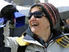 Susan Laufer, of New Jersey, waves a cowbell in preparation for Amgen riders to arrive at the start of Amgen bike race. 
