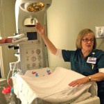 Peggy Wright, director of Barton's birthing center, shows off a warming unit. Photos/Kathryn Reed