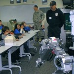 drugstore 030 Tahoe-Douglas fire Capt. Jim Anti, who is part of the bomb squad talks safety with kids Tuesday. Photo/Laurie Brazil