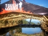 Nolan Kombol, head of course design for Tough Mudder showed us how it\'s done on the Funky Monkey where participants try to cross the frigid water below on inclining, declining and spinning monkey bars.