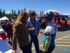 Amgen 2015: Inga Thompson, former Olympian and winner of the womenâs Tour de France, discusses the race with rider Robin Farina, who is on the Womenâs Cycling Association, and friend Kurt Stockton. Photo/Sue Wood