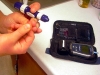 Kelsey Buckley, 8, tests her blood sugar at the Lake Tahoe Environmental Science Magnet School in Meyers.