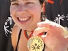 Lynn Taylor shows-off her gold medal Saturday after winning the 100 meter freestyle during the Northern California State Special Olympics at the Schaal Aquatic Center on the campus of UC Davis.