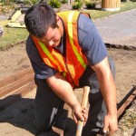 Shane Jones improves the sidewalk this week in front of the Star Building. Photo/Kathryn Reed