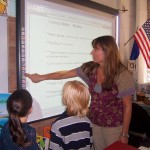 Susan Desrosiers uses new technology to teach Trinity Kirvida-McGowan and Logan Chapman. Photo/Provided 