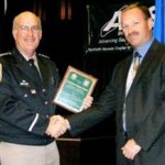 award Douglas County Sheriff Ron Pierini, left, congratulates Investigator Greg Rooney. Photo/Provided