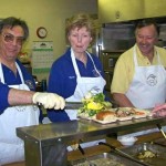 Pat Frega, Marie Foster and Tom Millham serve a hot meal at Bread & Broth. Photo/Georgette Riley