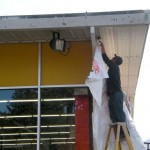 do it-1 Shane Guzman works on the exterior of the Do It Center this week. Photos/Kathryn Reed