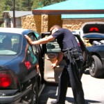 arrest Officer Jake Herminghaus speaks to one of the suspects on June 15. Photo/Kathryn Reed