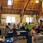 Visitors peruse the information booths at the Ericksson Center on July 10. Photo/Stephen Ward
