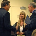 kathay Mayor Kathay Lovell speaks with new City Manager Tony O'Rourke, right, and City Attorney Patrick Enright on July 13. Photo/Kathryn Reed