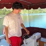 kid on boat Joe Zanetell fires up the electric boat at Fallen Leaf Lake. Photos/Kathryn Reed