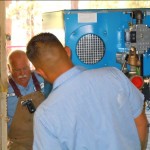 rec-1 Jim Fisher, left, and Duc Le begin installing the rec center boiler Aug. 23. Photos/Kathryn Reed