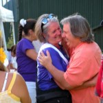 Cancer survivor Esther Carlen gets a hug from comic Howie Nave.