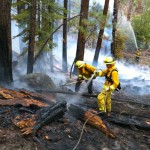 Firefighters extinquish a blaze near the Heavenly gondola Sept. 13. Photo/Taylor Flynn/Tahoe Mountain News