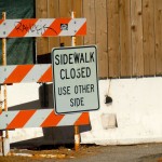 sign No sidewalk here to get to the other side.