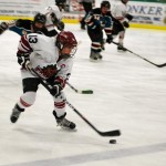 hockey 2 Carson Bailey, left wing for the Pee Wees, carries the puck over the blue line. Photos/Provided
