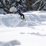 boarder Josh and his buddies James and Darren from Melbourne, Australia, create a snowboard jump in basketball area in the Tahoe Keys on Feb. 19. Photo/Kathryn Reed