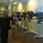 sths Principal Ivone Larson takes a photo of students by old film cameras. Photo/Provided