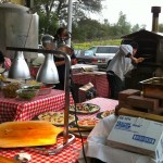 Charles B. Mitchell winery workers Kyle Gazlay and Noelle Savage serve up the wood-fired pizza.