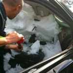 slide photo2 The car has to be dug out on the passenger side by resue crews.
