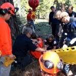 Fire personnel provide aid to the injured worker. Photo/Leona Allen 