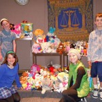 zces kids Ellie Krolicki, Trent Dingman, Caroline Krolicki and Alexandra Palant with the toys the collected for CASA. Photo/Kathryn Reed