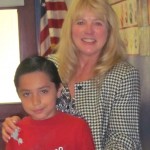 laurie Jesse Preciado, third-grader in Brenda Capshaw's class, receives an award from Laurie Brazil. Photo/Provided
