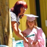 Maria Barrows-Crist hands Danika Yuzbick her preschool diploma June 17. Photos/Kathryn Reed