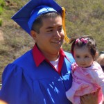 tallac lede Fidel Valdez Moya with his daughter in hand graduates June 10 from Mt. Tallac High School. Photos/Kathryn Reed
