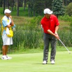 Todd Echan watches Aaron Rodgers make a putt at Edgewood Tahoe. Photos/Provided