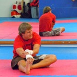 gym-2 Corey Carlson stretches before he spars at Escobar Training Grounds. Photos/Kathryn Reed