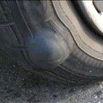 tire Potholes can cause serious tire damage.
