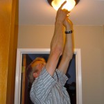 audit-1 Sten Seemann checks to see the type of bulbs in this fixture. Photos/Kathryn Reed