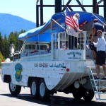 A duck boat driver/captain was cleaning underneath the vehicle/boat Aug. 18 at the Tahoe Keys Marina parking lot before hoping aboard. Photo/Kathryn Reed