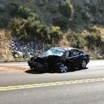 The driver of this sedan sustained a leg injury.