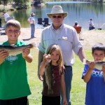 Moose Lodge Gov. Barry Keil with fishing derby winners Gavin Hanson (second), from left, Diane Doremus (third), and Dillon Switzer (first). Photo/Provided