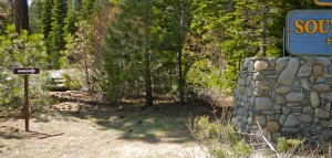 The trail sign to the left indicates where one end of the new paved bike trail will go, with the STHS sign to the right.