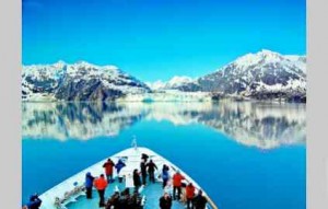 A small cruise ship plies the waters of Alaska