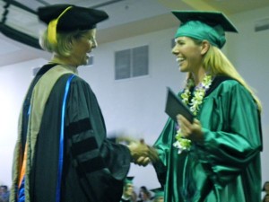 LTCC President Kindred Murillo congratulates Raina Patrocinio.
