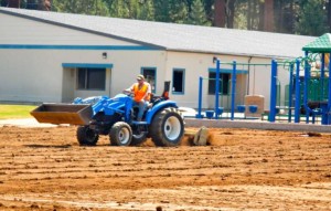 Crews work July 26 on Sierra House Elementary School's field. Photo/LTN