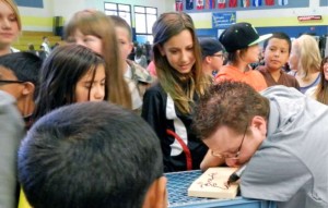 Brett Eastburn signs autographs Sept 26 for South Tahoe Middle School students. Photo/Kathryn Reed