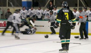 Team captain Kyle Blondin looks on as a fight breaks out during the Lake Tahoe Blue vs. Long Beach Bombers game last weekend.