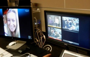 In the control room of South Tahoe High School's screening room Jamie Anderson, left, can be seen Skyping with students on Dec. 16. Photo/Kathryn Reed