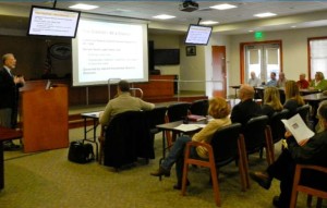 South Tahoe PUD General Manager Richard Solbrig, left, explains the district's capital improvement needs Dec. 19. Photo/Kathryn Reed