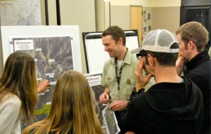 U.S. Forest Service recreation specialist Jonathan Cook-Fisher, center, talks Dec. 18 to people about Heavenly's proposed mountain bike trails. Photo/Kathryn Reed