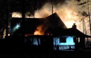 Flames fully engulf a house Jan. 29 in South Lake Tahoe. Photo/Denise Haerr