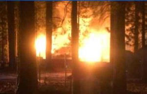 Flames destroy a house in South Lake Tahoe on Jan. 29. Photo/Denise Haerr