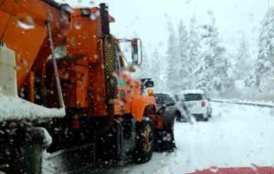 A Caltrans plow maneuvers Jan. 30 around stalled cars on Echo Summit. Photos/Kathryn Reed