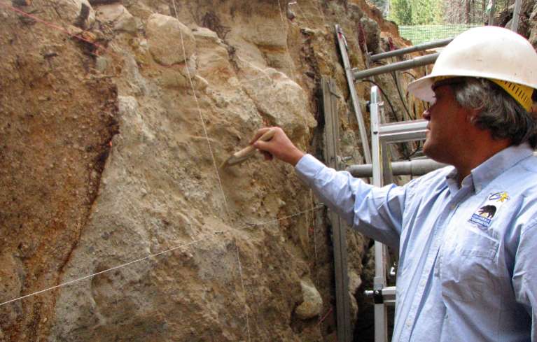Gordon Seitz in the trench brushing dirt from the walls. The dark diagonal line or crack you see in the wall of the trench is the actual fault line. Photos/Provided